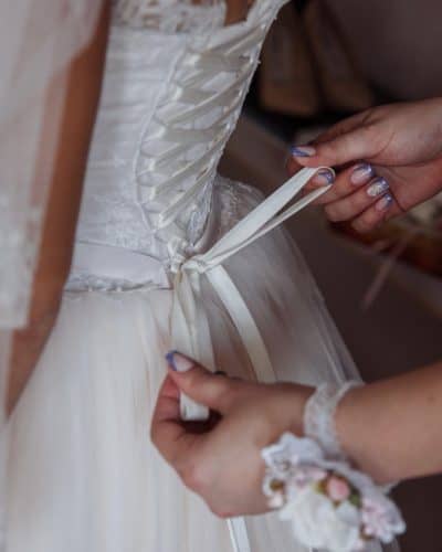 bride-is-helped-put-dress (1)